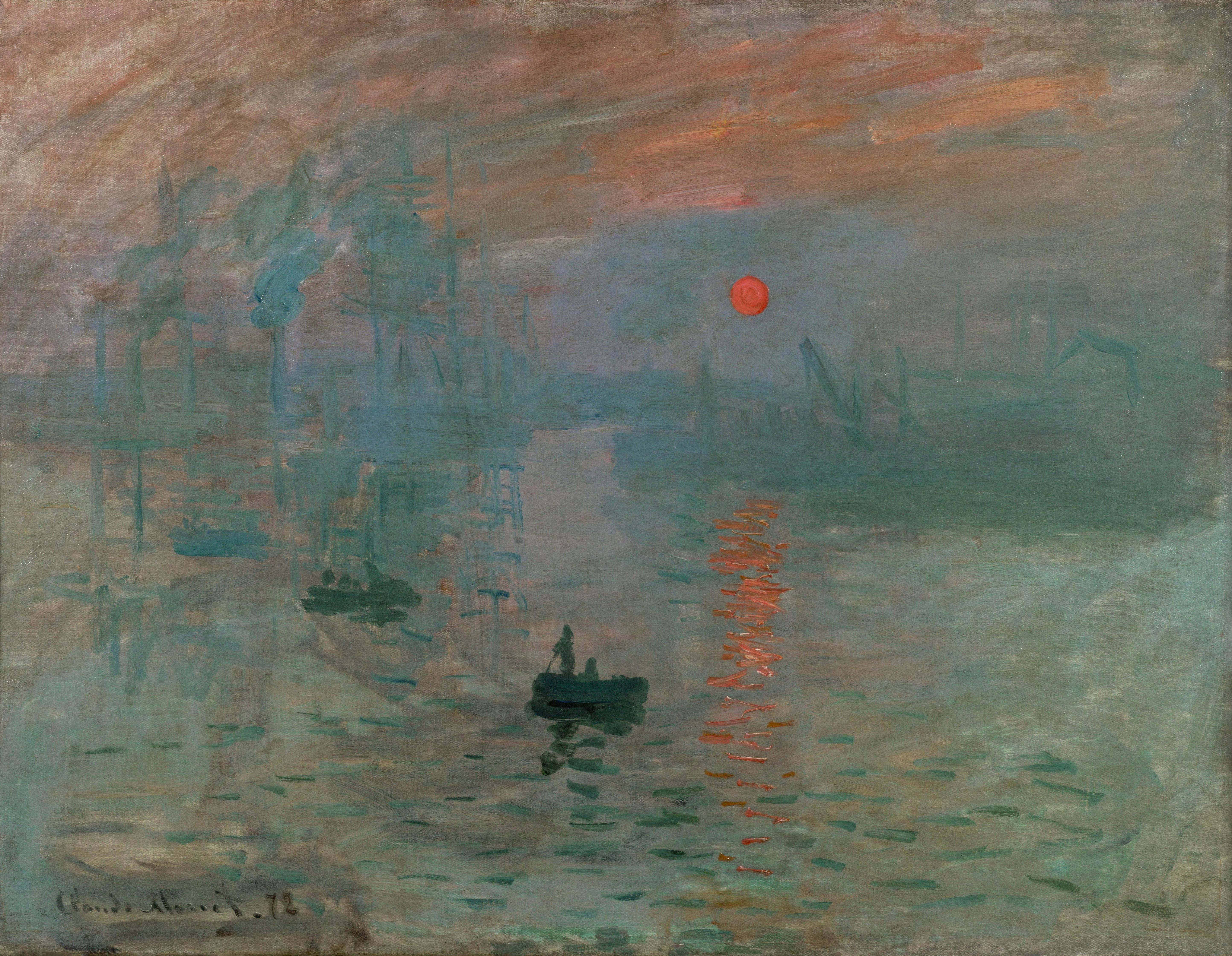 A single small boat is on the water, while a red sun rises and casts a long reflection.
