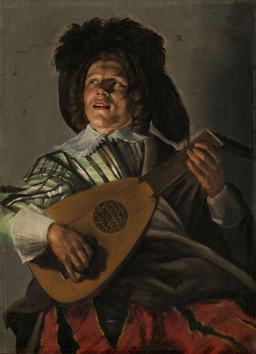 A man with medium-light skin and dark hair is playing a lute and looking upward and away from the viewer out of the corners of his eyes, his mouth slightly open. He is wearing a green shirt with black and white vertical stripes and white lacy collar and cuffs, and red pants with wide black vertical stripes. He appears to also wear a large hat with a dark feather or fur trim.