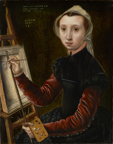 A young woman with very light skin, large dark eyes, reddish-brown hair, and a serious expression sits at an easel with paintbrushes and palette in her hands. She wears a white cap over her hair and a black dress with red sleeves. She looks directly out at the viewer.